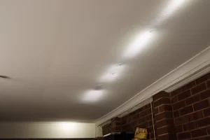 Major structural defect shown by ceiling sagging and surface deformation indicating potential moisture damage and compromised building structure
