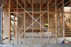 Timber frame structure with steel bracing showing wall framing and foundation alignment in Berwick construction