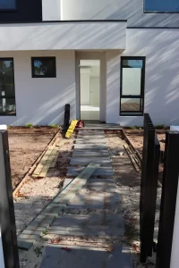 Front pathway and entry area under inspection before handover in Melbourne new build
